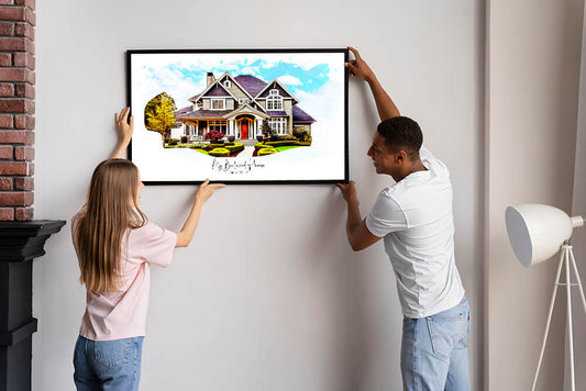 Couple hanging a frame on the wall