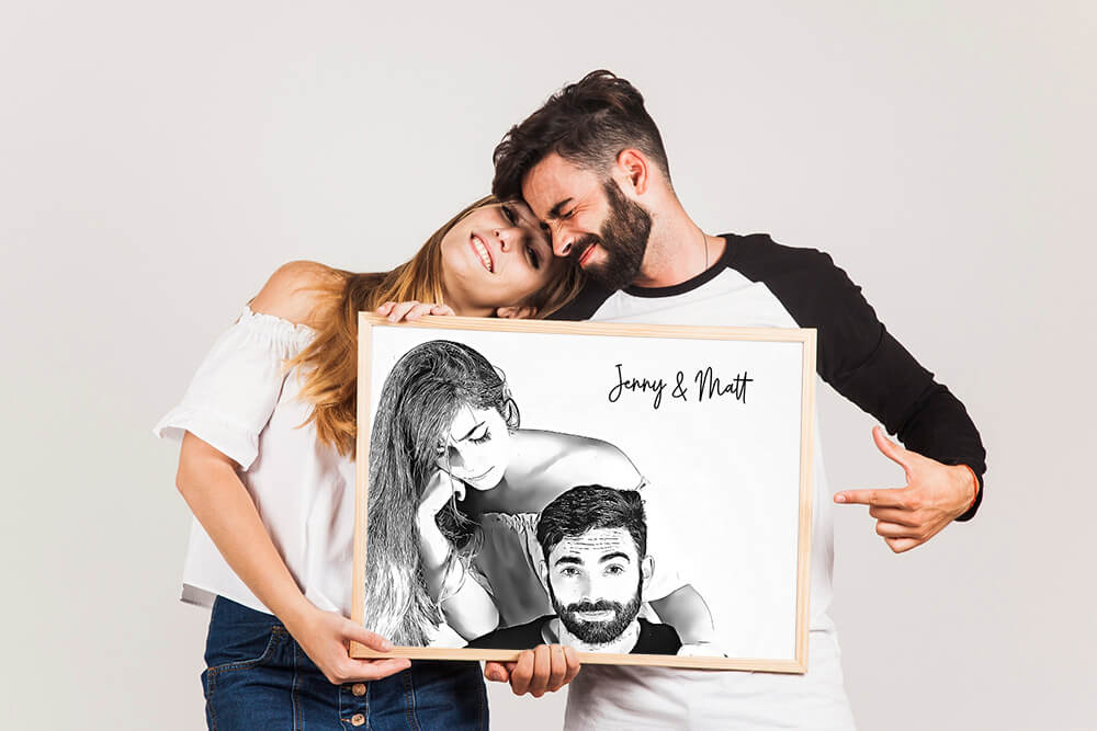 Couple holding a sketch frame of them